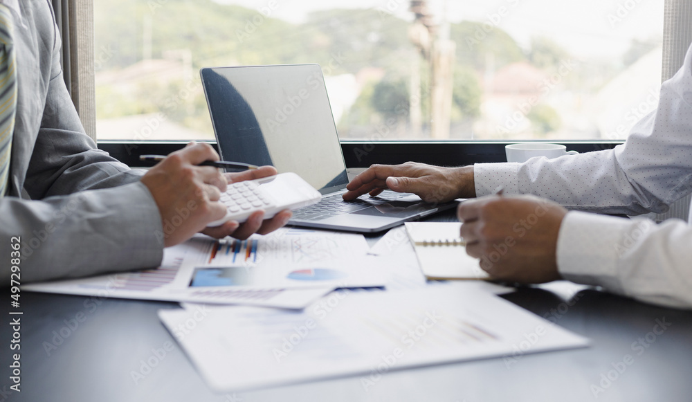 Businessman collaboration discussing working analyzing with financial data and marketing growth report graph. Businessman collaboration discussing working analyzing with financial data and marketing growth report graph.
