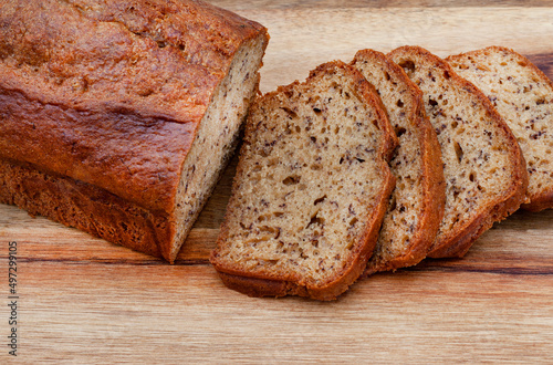freshly baked rustic style banana bread loaf on country style table