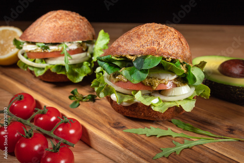 Healthy Vegan Burger. Hamburgers on a wooden table and vegetables
