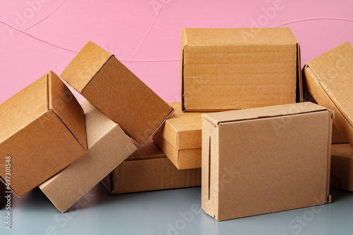 Set of cardboard boxes on pink background © fotofabrika