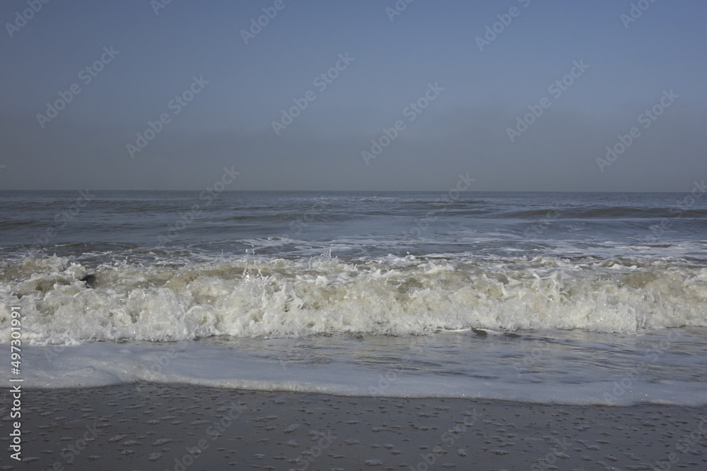 Rolling waves at the Dutch North Sea coast, concept: freshness, holiday, serenity (horizontal), Noordwijk, South Holland, Netherlands Rolling waves at the Dutch North Sea coast, concept: freshness, holiday, serenity (horizontal), Noordwijk, South Holland, Netherlands