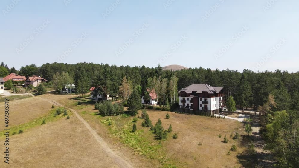 Aerial view of new apartment buildings on Zlatibor mountain resort, Serbia on sunny summer day Aerial view of new apartment buildings on Zlatibor mountain resort, Serbia on sunny summer day