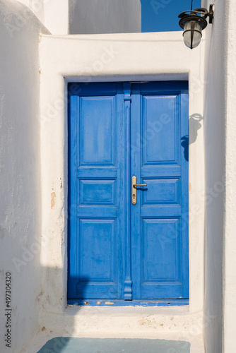 Blue Greek door. Pyrgos village on Santorini island, Greece © vivoo