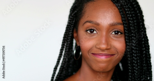 Millennial pretty black African girl posing to camera