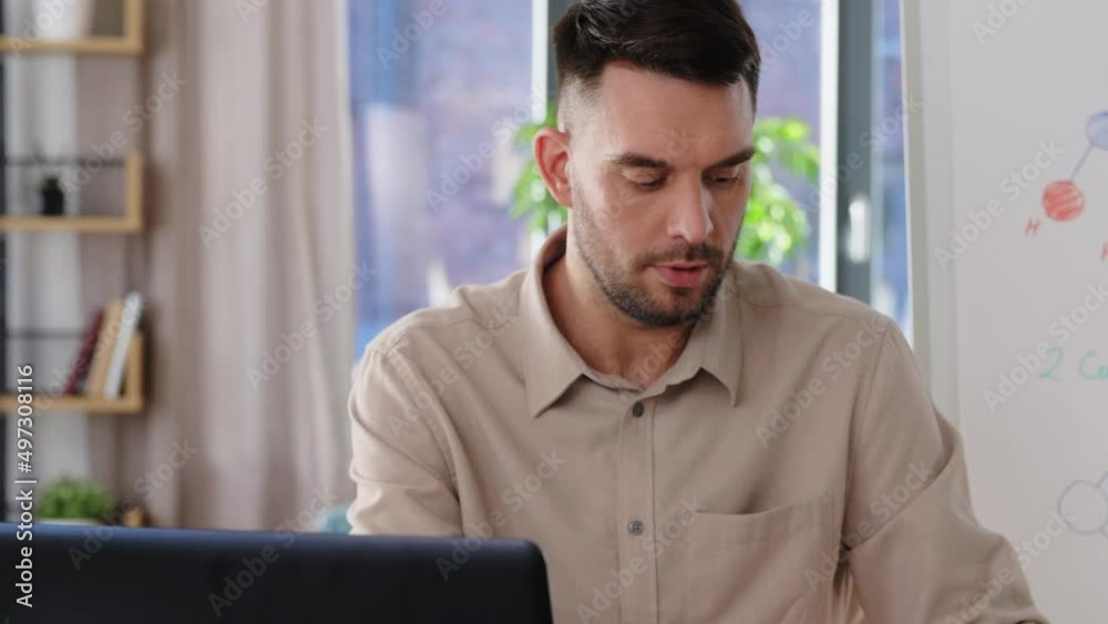 distance education, school and remote job concept - male chemistry teacher with laptop computer and molecular model having online class at home office