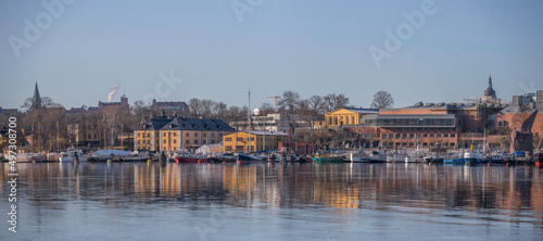 Panorama view over the island Skeppsholmen with museums and various ships at the pier  a sunny spring day in Stockholm