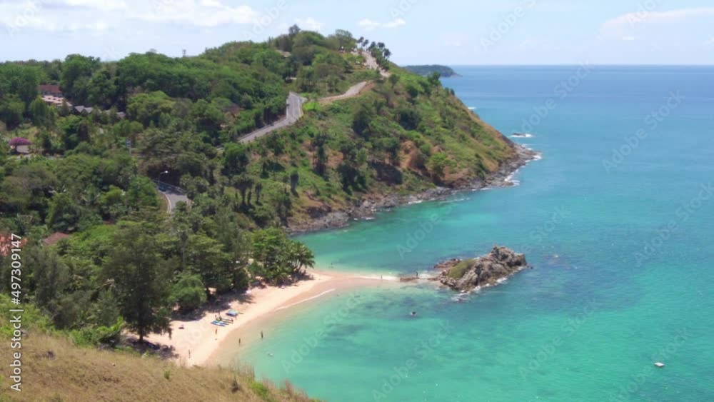 Nai Harn, Naiharn Beach Phuket and Rawai Beach with beautiful blues and Greens, turquoise oceans islands mountains boats trees windmill, wind turbine in the beautiful resort island of phuket thailand