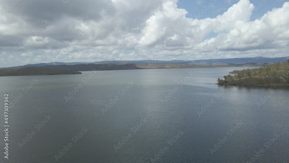 Quaids Dam With Serene Water At Daytime - Lake Mitchell In QLD, Australia. - aerial ascend Quaids Dam With Serene Water At Daytime - Lake Mitchell In QLD, Australia. - aerial ascend