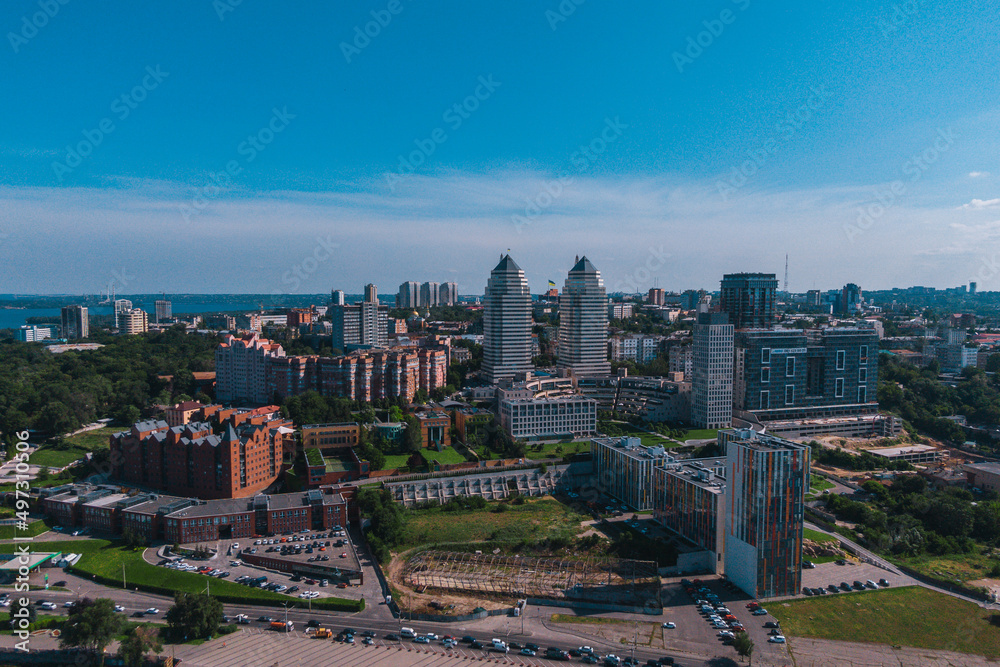 Obraz premium Dnipro, Ukraine. View of the central part of the city, the embankment of the Dnieper. Top view from a great height. Panoramic view of the city. Right bank of the city