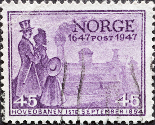 Norway - circa 1947: a postage stamp from Norway , showing audience in period clothing in front of the First Norwegian railways