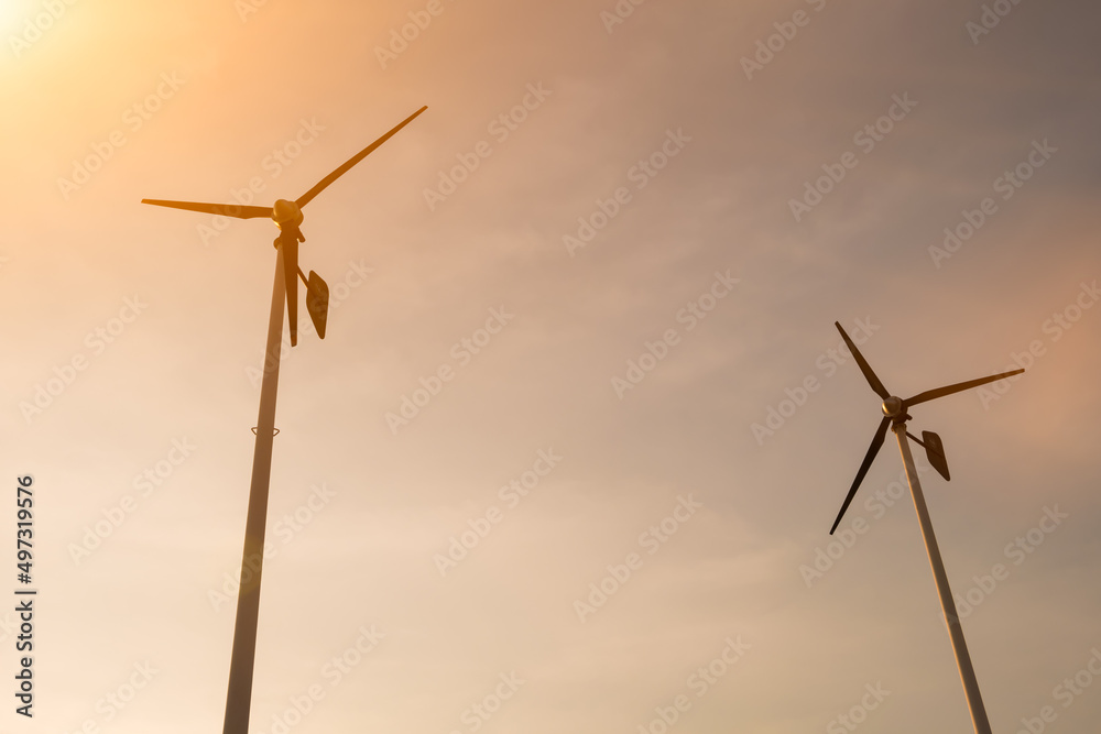 Wind turbines from ant view in sky background. Wind turbines from ant view in sky background.