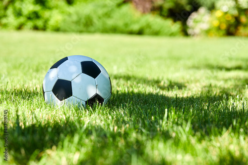 football ball on green grass lawn