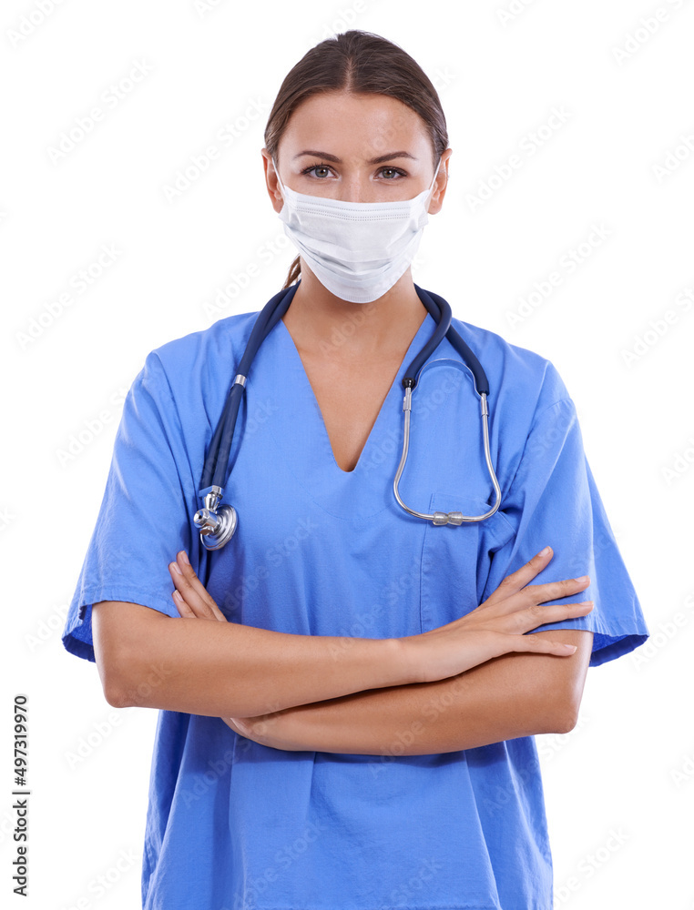 Ready for your surgery. A young surgeon wearing scrubs and a surgical mask looking at the camera. Ready for your surgery. A young surgeon wearing scrubs and a surgical mask looking at the camera.