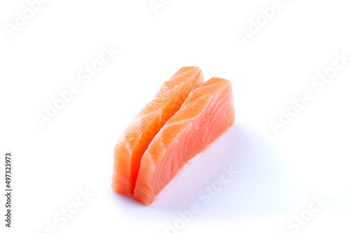 two pieces of raw salmon sashimi sushi japanese food close up cut angle isolated on white background