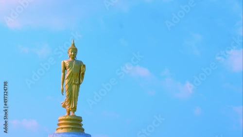 Time lapse : The standing buddha with blue sky and clounds , Chanthaburi Thailand