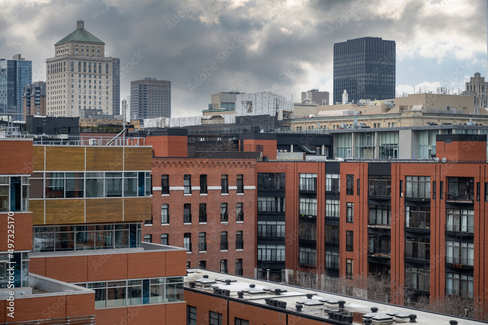 View of modern Old Montreal with downtown buildings in the background.