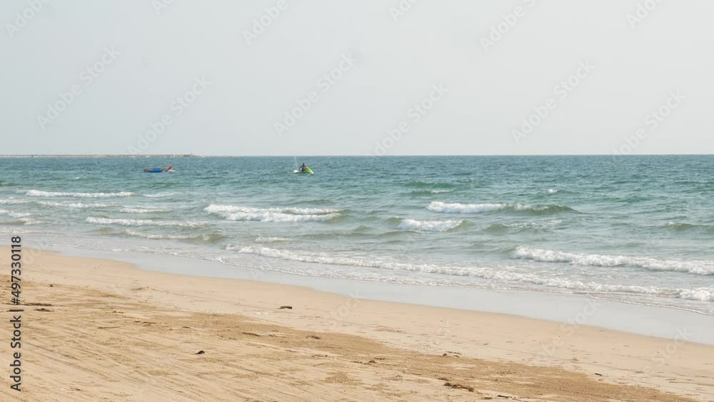 Tropical beach view,Sea waves seamless loop on the beautiful sand beach. Tropical beach view,Sea waves seamless loop on the beautiful sand beach.