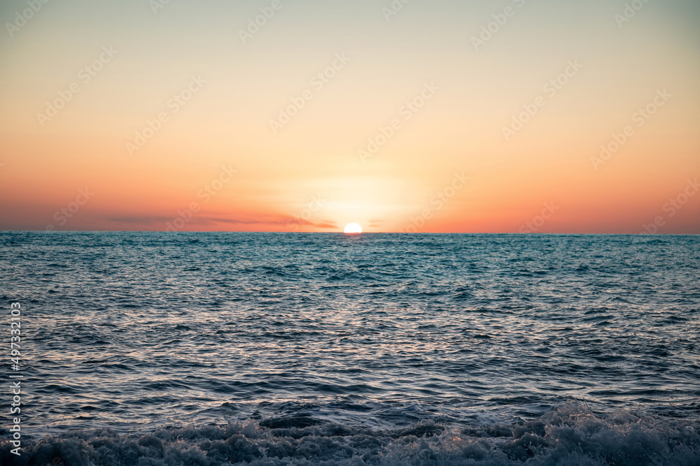 The sea wave. Sunset in the sea. The power of the elements. Landscape photography.