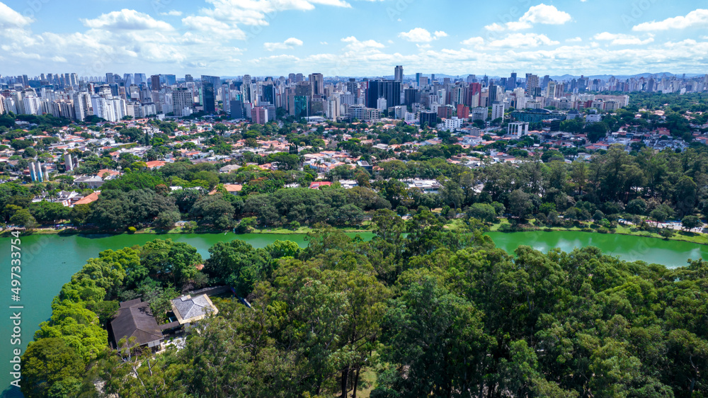Obraz premium Aerial view of Ibirapuera Park in São Paulo, SP. Residential buildings around. Lake in Ibirapuera Park
