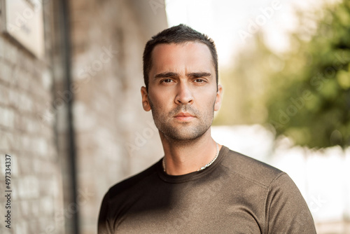 handsome man with short bristles in a black T-shirt