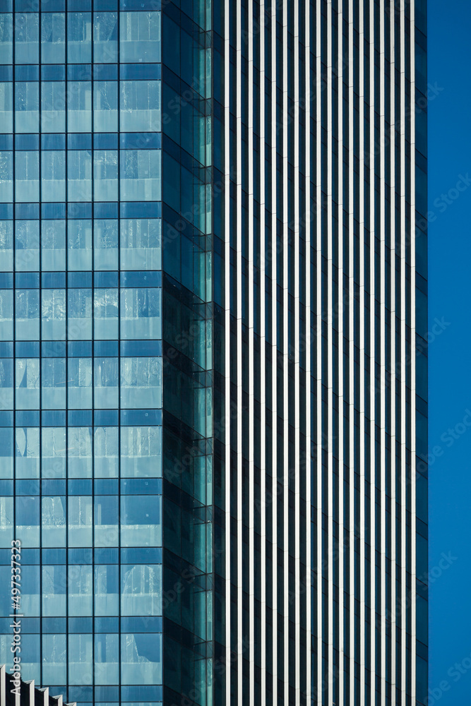 Modern building facade. Vertical lines abstract facade in modern office building. New skyscraper.