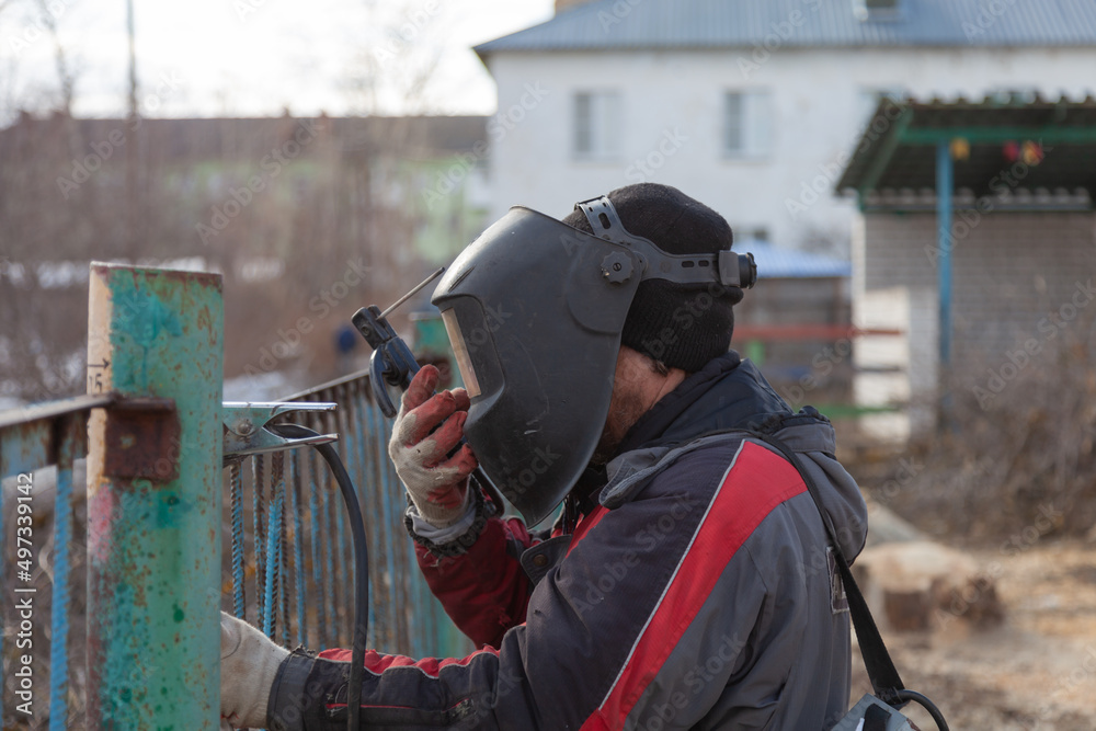 Metal welding, metal fence repair.