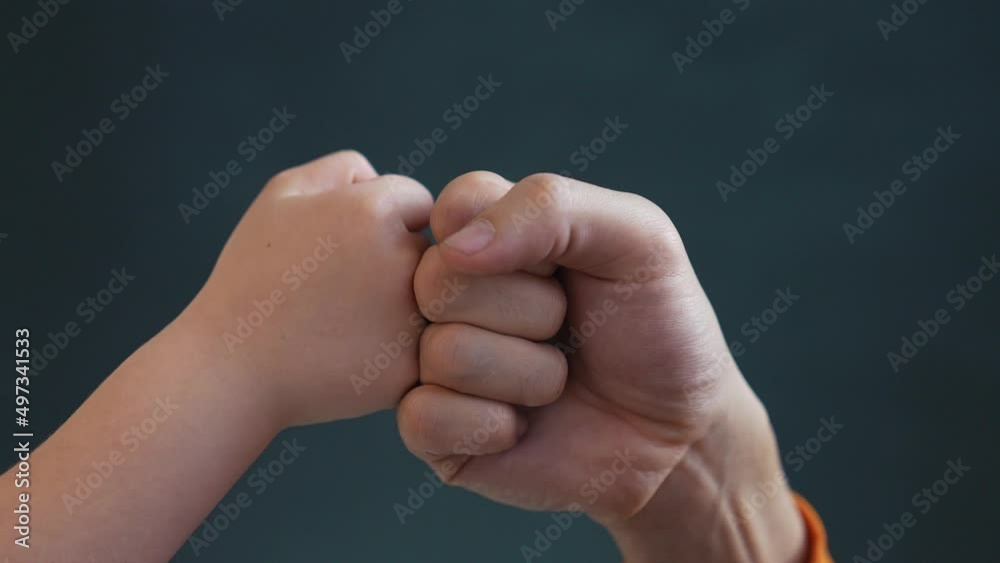 teamwork business concept. fist to fist commit solidarity a respect and brotherhood gesture. business kid team hands fists. happy family partnership friendship teamwork. father close-up and daughter teamwork business concept. fist to fist commit solidarity a respect and brotherhood gesture. business kid team hands fists. happy family partnership friendship teamwork. father close-up and daughter