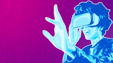 Woman using virtual reality simulator VR goggles virtual reality web 3 or metaverse metaphor. Horizontal banner with copy space, place for text or text area	