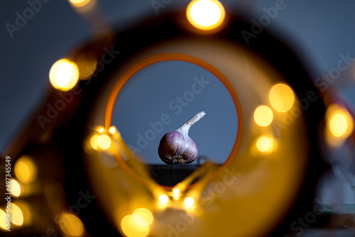 garlic bulb with bokeh lights © Peteris Zalitis