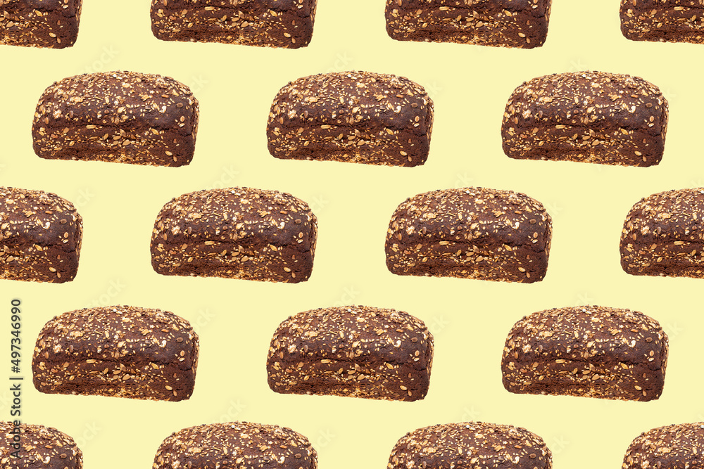 Whole dark bread with seeds on a yellow background. Seamless pattern. Whole dark bread with seeds on a yellow background. Seamless pattern.