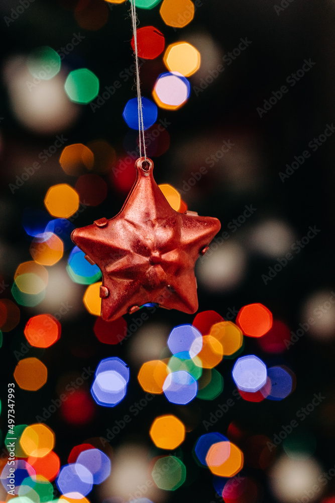 Red decorative star on the background of festive Christmas lights. Christmas decorations. bokeh. Christmas. New Year Red decorative star on the background of festive Christmas lights. Christmas decorations. bokeh. Christmas. New Year