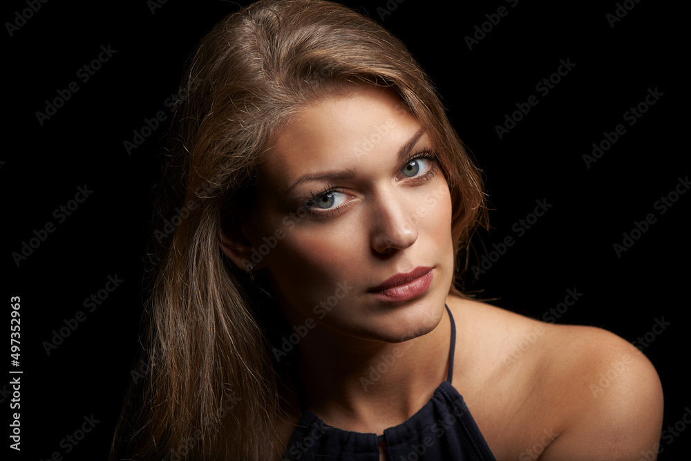 Closeup of young beautiful woman over black background Closeup of young beautiful woman over black background