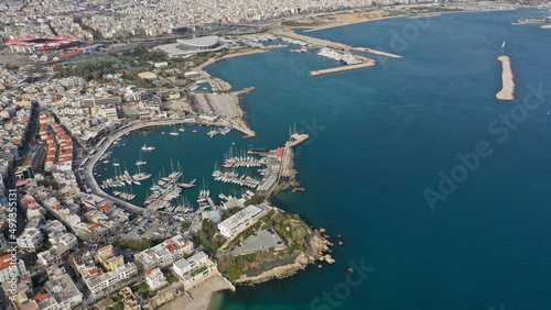Aerial drone photo of iconic round shaped picturesque port of Mikrolimano with anchored sail boats and yachts after renovation, Piraeus, Attica, Greece © aerial-drone