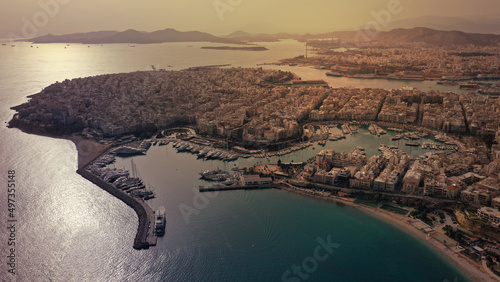 Aerial drone panoramic photo of famous port and Marina of Zea with luxury yachts docked as seen from great height at sunset, Piraeus, Attica, Greece
