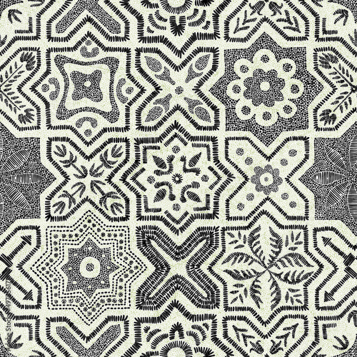 Seamless pattern in patchwork style. Embroidered bohemian print. Vector illustration.