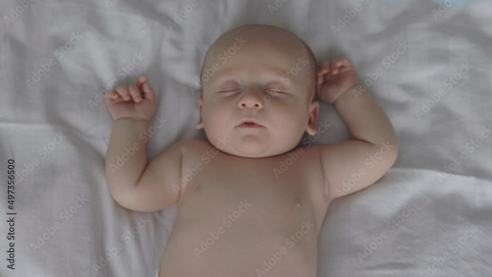 Caucasian infant having sweet dreams in comfy bed Caucasian infant having sweet dreams in comfy bed