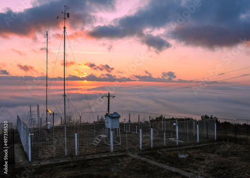Mahmudia weather station at sunrise with sea of clouds
