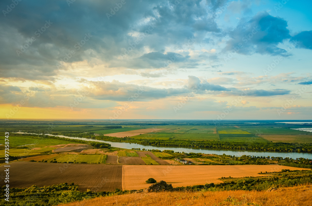 sunset with clouds in the Danube delta in summer