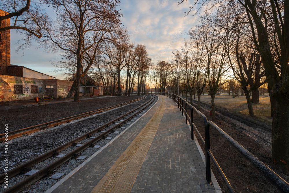 Fototapeta premium Żnin, Poland December 22, 2021 Tracks to the historic narrow-gauge railway in the city of Żnin. Tourist attraction.