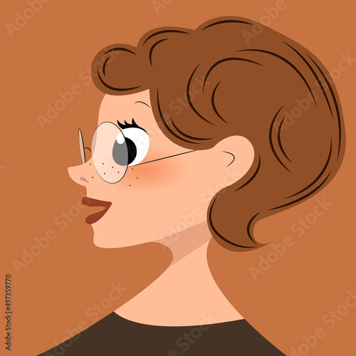 woman in profile with short brown hair wearing glasses