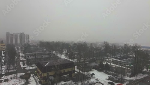 heavy snowfall snowstorm over the city village snow falls spring. High quality 4k footage
