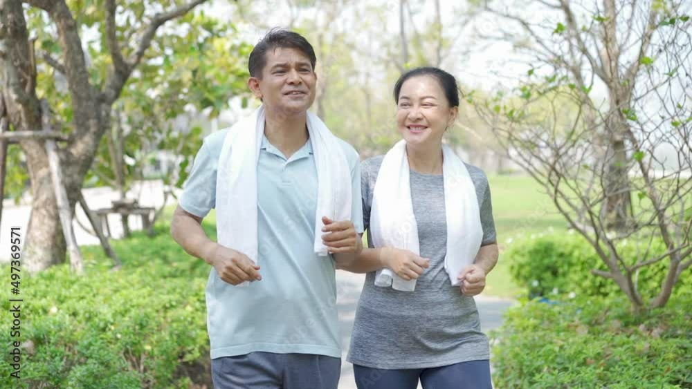 Couple doing exercising by running in the garden. Sporty mature couple staying fit with sport. Couple doing exercising by running in the garden. Sporty mature couple staying fit with sport.