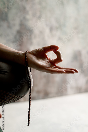 Meditation practice, hands puffed in om tonk mudra jet of incense smoke. 
Beads hanging on the hand.Close up