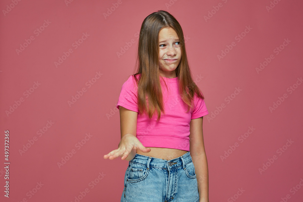 Dissatisfied grimacing cute child girl showing so so gesture on pink studio background. Questionable choice. Bad options Dissatisfied grimacing cute child girl showing so so gesture on pink studio background. Questionable choice. Bad options