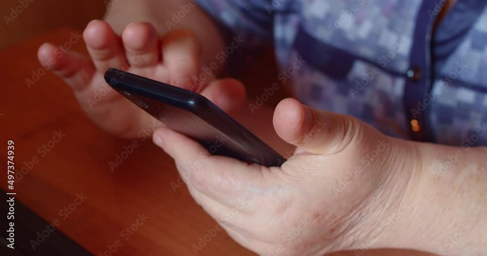 Senior woman hand using smartphone for call and talking. Elderly female person communicate by cell phone Senior woman hand using smartphone for call and talking. Elderly female person communicate by cell phone