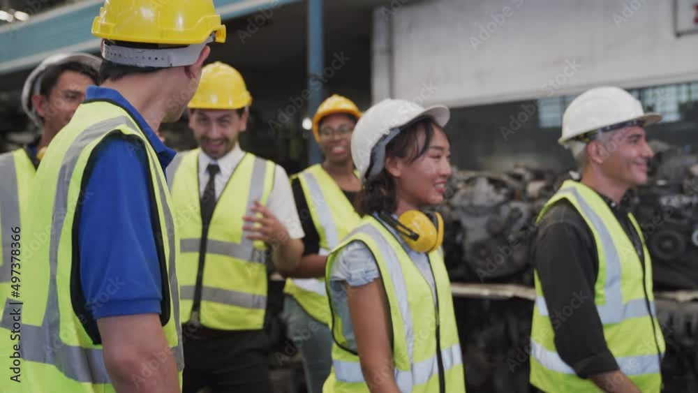 Group of industrial workers laugh. Happy warehouse worker laughing and smiling while enjoying working in factory. Group of industrial workers laugh. Happy warehouse worker laughing and smiling while enjoying working in factory.