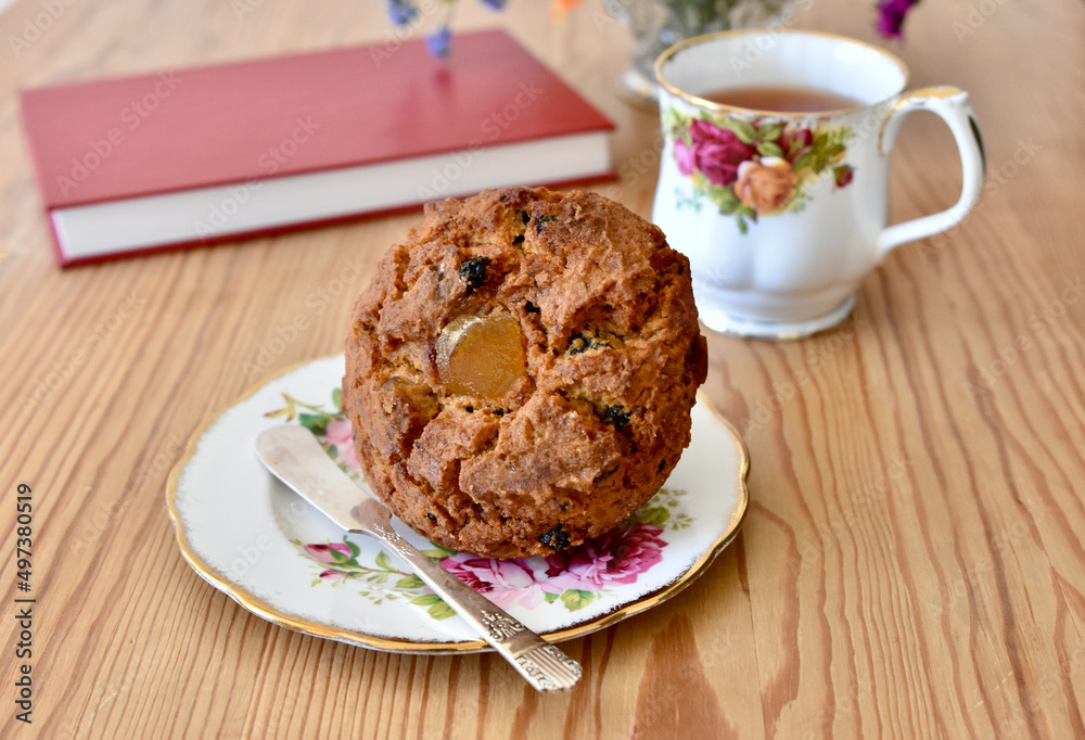 Simple tasty tea and muffin for breakfast or afternoon relaxing snack to enjoy with a good book. Simple tasty tea and muffin for breakfast or afternoon relaxing snack to enjoy with a good book.