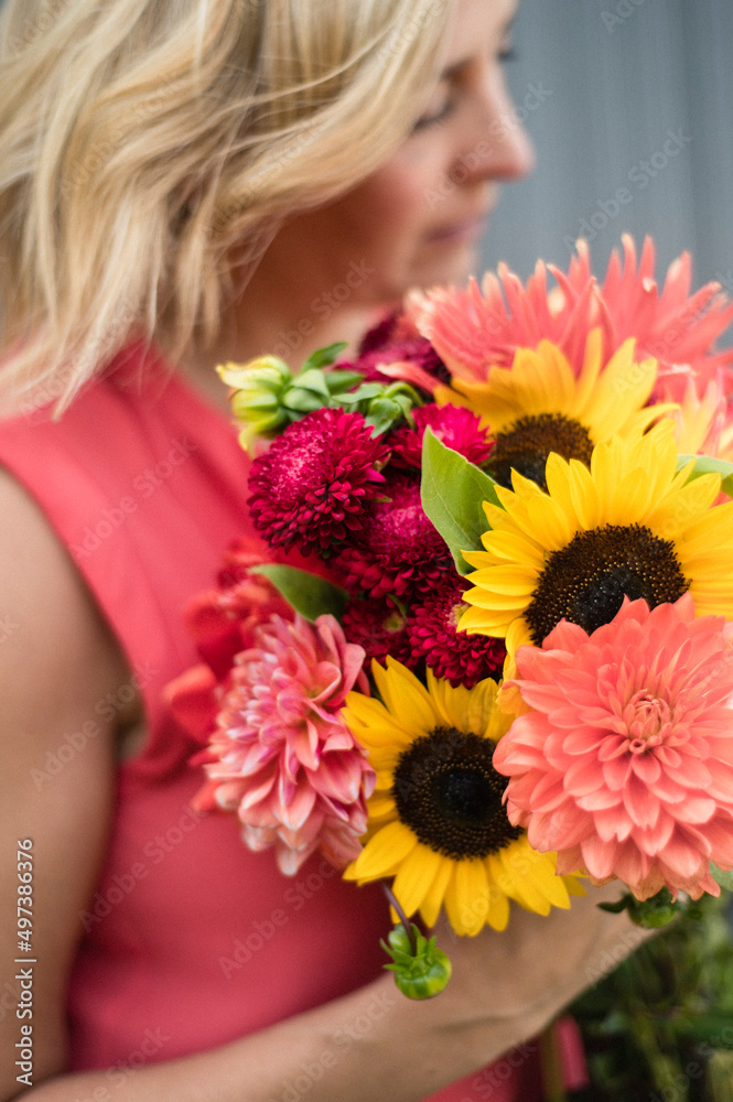 Close Up of Woman Holding Bouquet of Summer Flowers