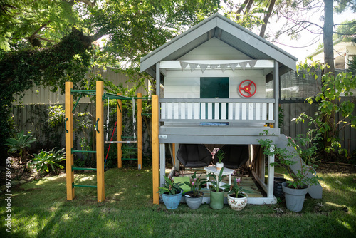 Kids cubby house in tropical Australian backyard photo