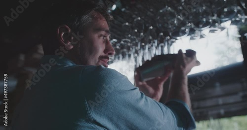 Caucasian bartender shaking cocktail